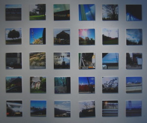 A wall of tiny cell phone camera shots from moving cars by Ted Mosher.
