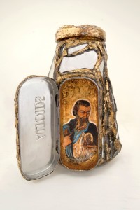 William Rhodes, St. Jude Bottle, found bottle, glass, gold leaf, paint and found objects, 6 x 5 x 3 in. is in the show Ashe to Amen now showing in Memphis, TN.