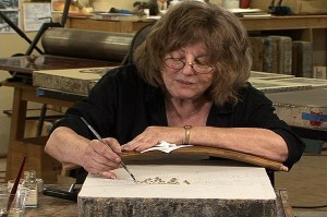 Lithographer Ann Chernow, working on her anti-war print in the movie
