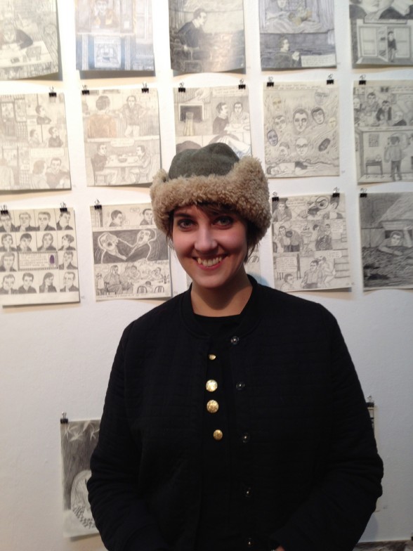 Clara Bessijelle, with pages from her comic, Face Man