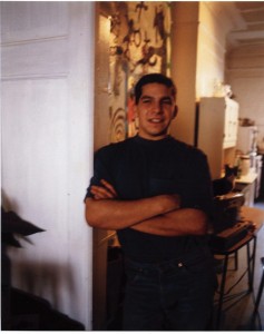 James Meyer standing in front of one of his paintings, NYC 1991. © Ken Schles