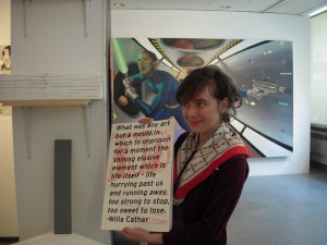 Manya Scheps, holding up a book she made for her senior thesis show. New Asshole is the same size.