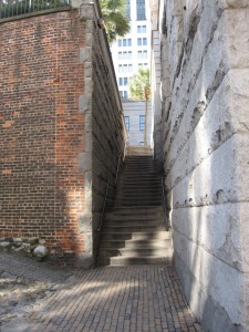 The bay front is on a level below the city. Some buildings have entries on the upper level, but the buildings also reach down to the lower level where they also have entryways.