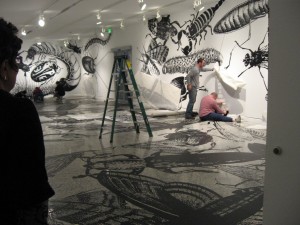 Regina Silveira's insect invasion being installed at Moore College of Art and Design.