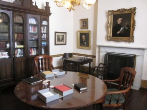 Ruth Scott Blackson’s series of artist’s books (seen on table) are on display to the public as part of “Through the Pale Door” at the Athenaeum.