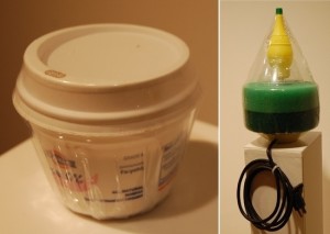 Sarah Peoples, Yogurt Coffee (left), yogurt container, disposable plastic coffee cup lid and shrink wrap, and Lemon Filter, fish pond filters, lemon juice container, rubber bottle nipple, rubber tubing, electrical cord, produce container and shrink wrap.