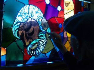 LeCompte painting a panel from one of the lancet windows designed for the National Cathedreal