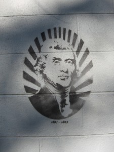 I admired this stenciled on a cinderblock wall in Savannah, on the back of a house. I have no idea who it is or who did it, but I loved the formal portrait as a stencil. Maybe it's political!