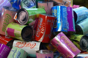 Coke Zero Cans (installation shot), individually measure 12.5″ x 7.5″ x 7.5″, mixed media: screenprints on metalized laminate, cardboard, and polyacrylic, 2011 – 2013. Photo: David Mielcarek.