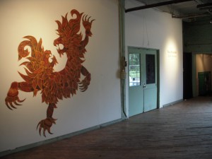 Tory Franklin, heraldic dragon creature in the entry way of FLUXspace.