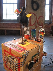  Reade Vaisman, Twittering Machine, 2008, salvaged plywood, toy, tape recorder, stereo, tripod, and electrical components